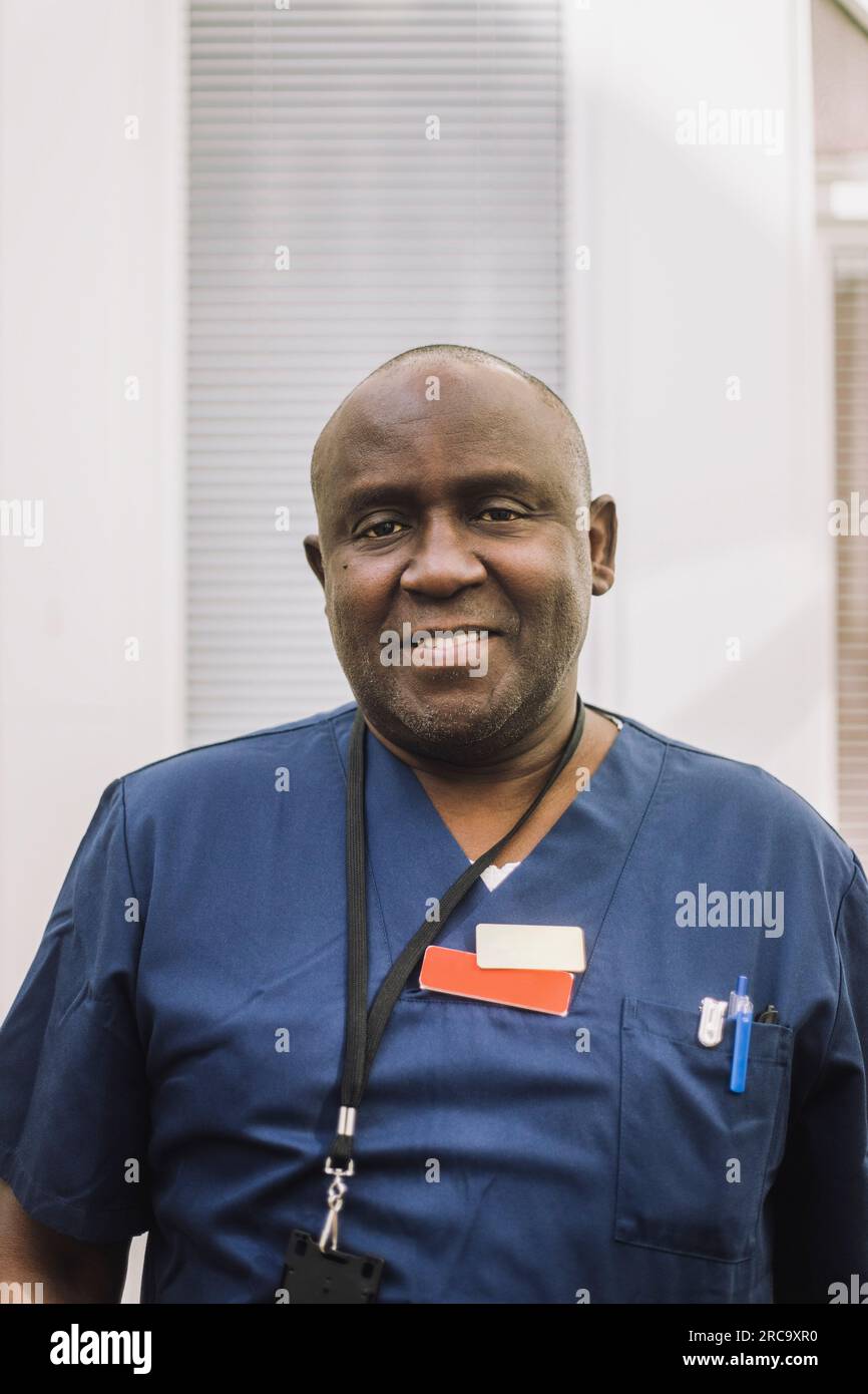 Portrait of smiling male doctor at healthcare center Stock Photo - Alamy