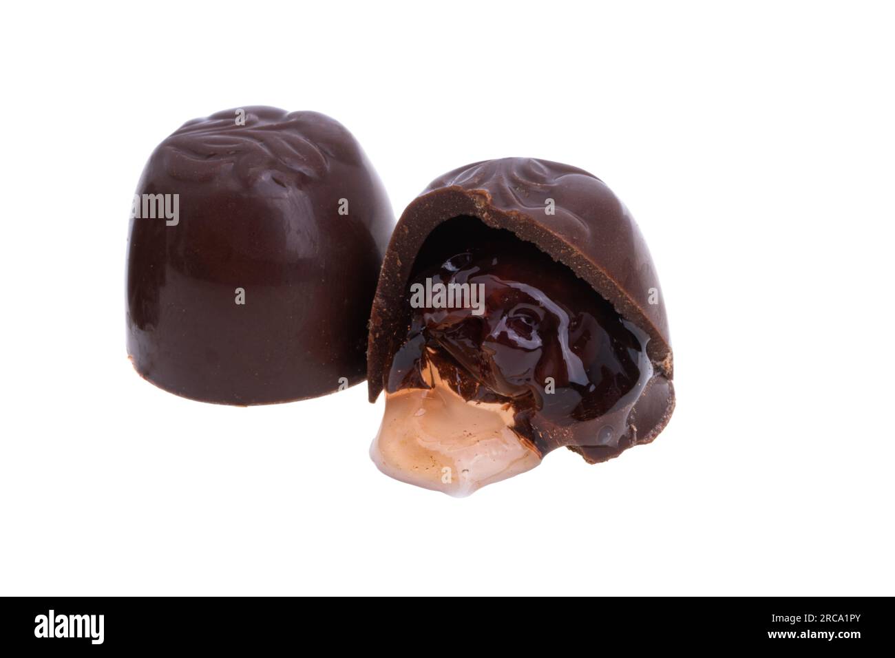 chocolate candies with cherries and liqueur isolated on white