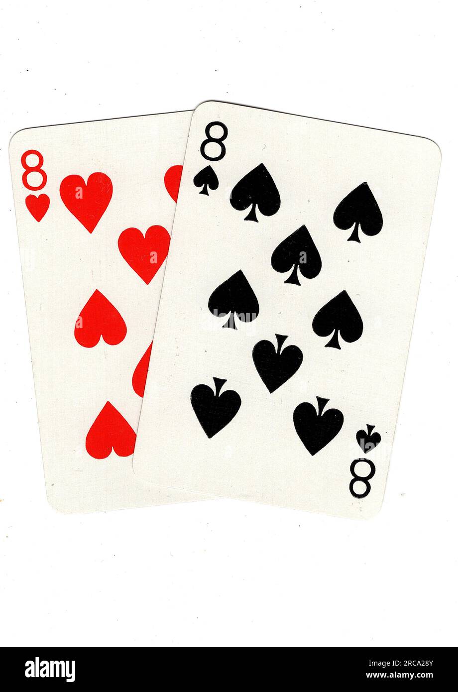 Vintage playing cards showing a pair of eights on a white background. Stock Photo