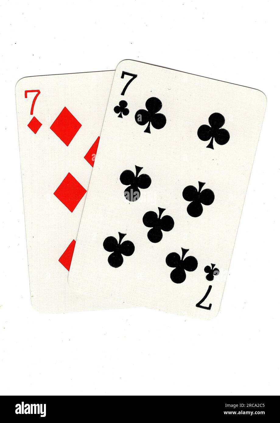 Vintage playing cards showing a pair of sevens on a white background