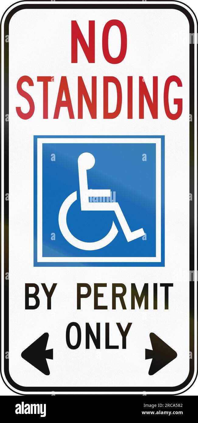 A Road sign in Canada Disabled standing by permit only. This sign is