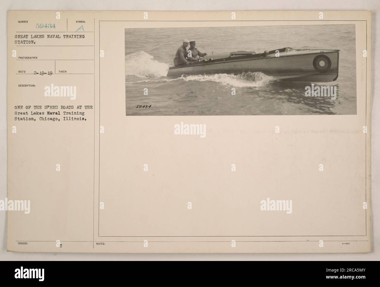 Speed boat at the Great Lakes Naval Training Station in Chicago, Illinois. The photograph was taken by a photographer named RECO on March 19, 1919. This specific boat is identified by the 59434 symbol issued. There are additional notes on the photograph, designated as 59454. Stock Photo