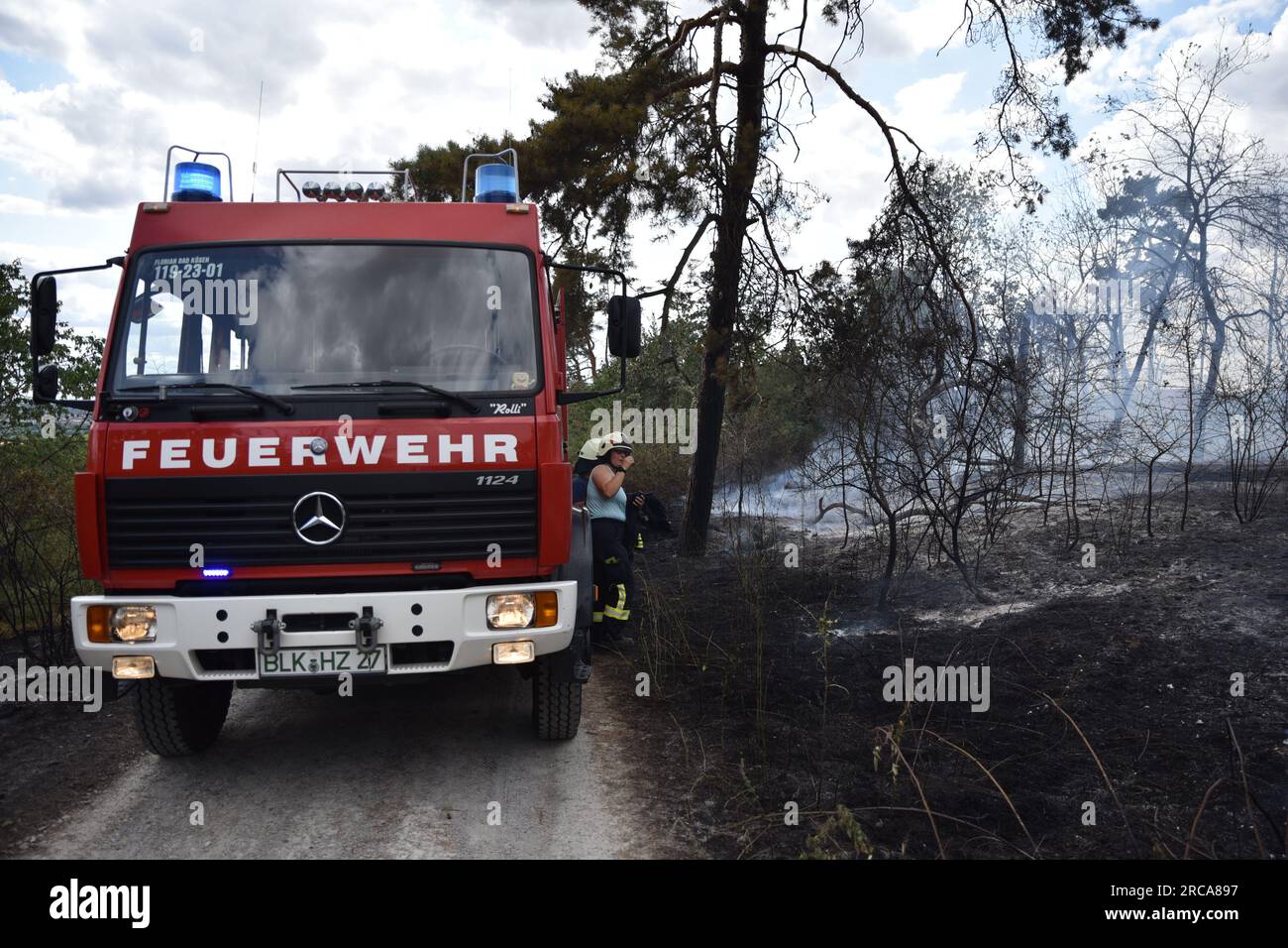 Eulau, Germany. 13th July, 2023. Firefighters try to contain a fire near Eulau. A fire broke out between the towns of Markröhlitz and Eulau in the Burgenland district on Thursday afternoon. Credit: Thomas Dilthey/dpa/Alamy Live News Stock Photo