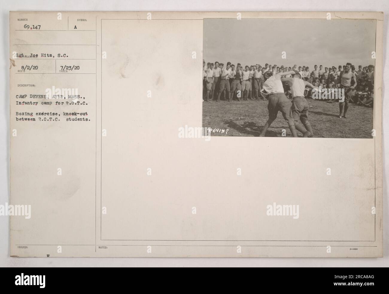 CAMP DEVENS, AYER, MASS. - Infantry camp for R.O.T.C. Boxing exercise, showing a knockout between two R.O.T.C. students. This photograph captures a moment of intense physical training and competition during World War One. The R.O.T.C. students displayed their boxing skills as part of their training at Camp Devens in Ayer, Massachusetts. Stock Photo