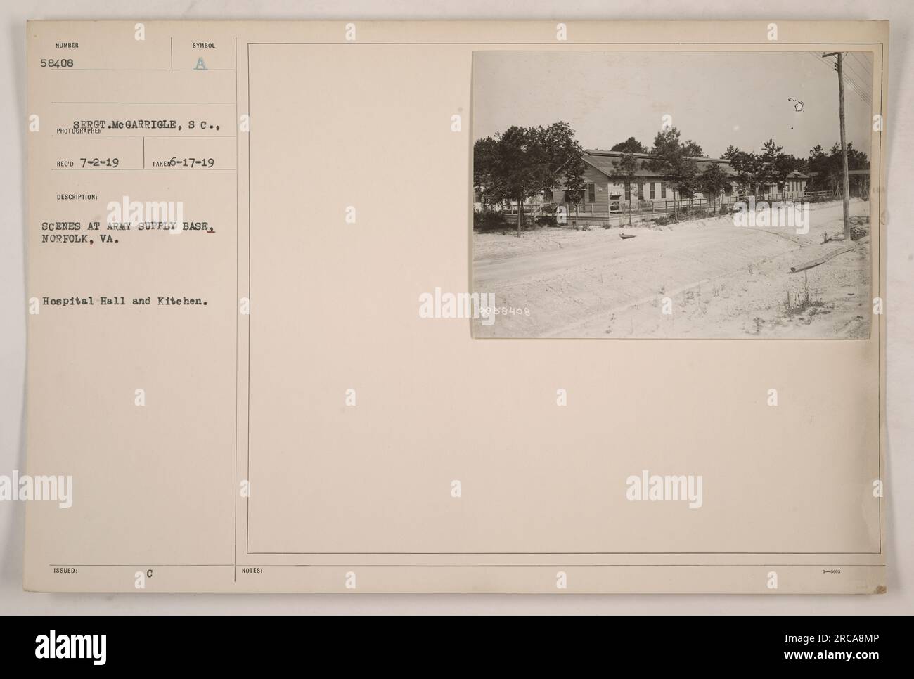 Army personnel working in the hospital hall and kitchen of the Army Supply Base in Norfolk, Virginia. Sergeant Me Garrigle, a member of the S.C. Photoexper Reco, captured these scenes on July 2, 1919. This image is part of the series numbered 58408 and was issued by the SYMBOL TAKE-17-19. Stock Photo