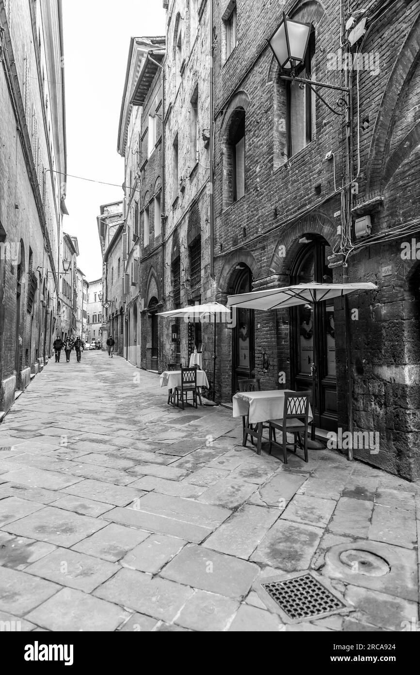 Siena, Italy - APR 7, 2022: Generic architecture and street view from the historical Italian city of Siena in Tuscany. Stock Photo