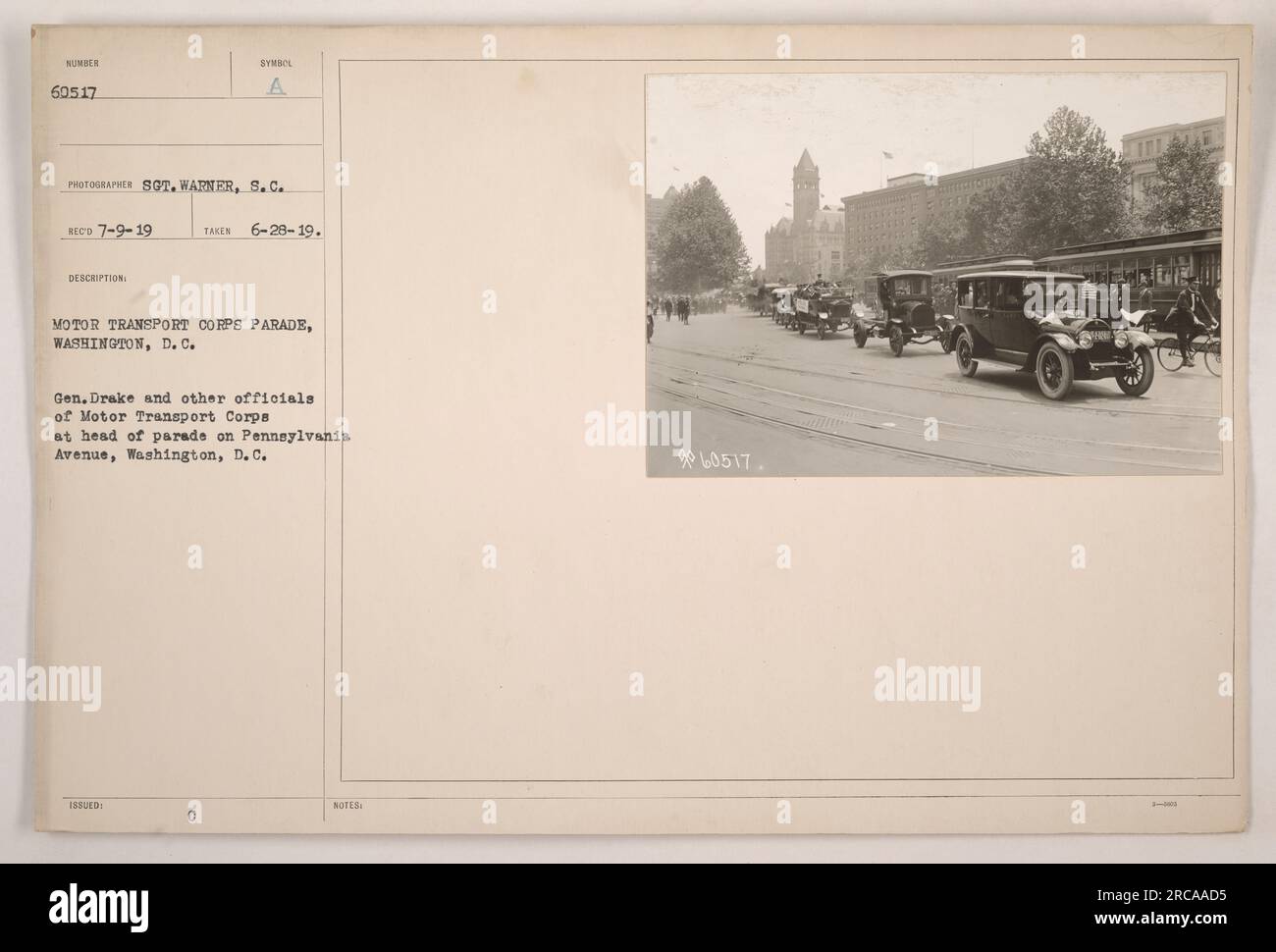 Motor Transport Corps parade in Washington, D.C. General Drake and other officials of the Motor Transport Corps are seen leading the parade on Pennsylvania Avenue. The photograph was taken by S.C. Warner and received on July 9th, 1919. The image captures a symbolic event showcasing the motor transport capabilities of the Corps. Stock Photo