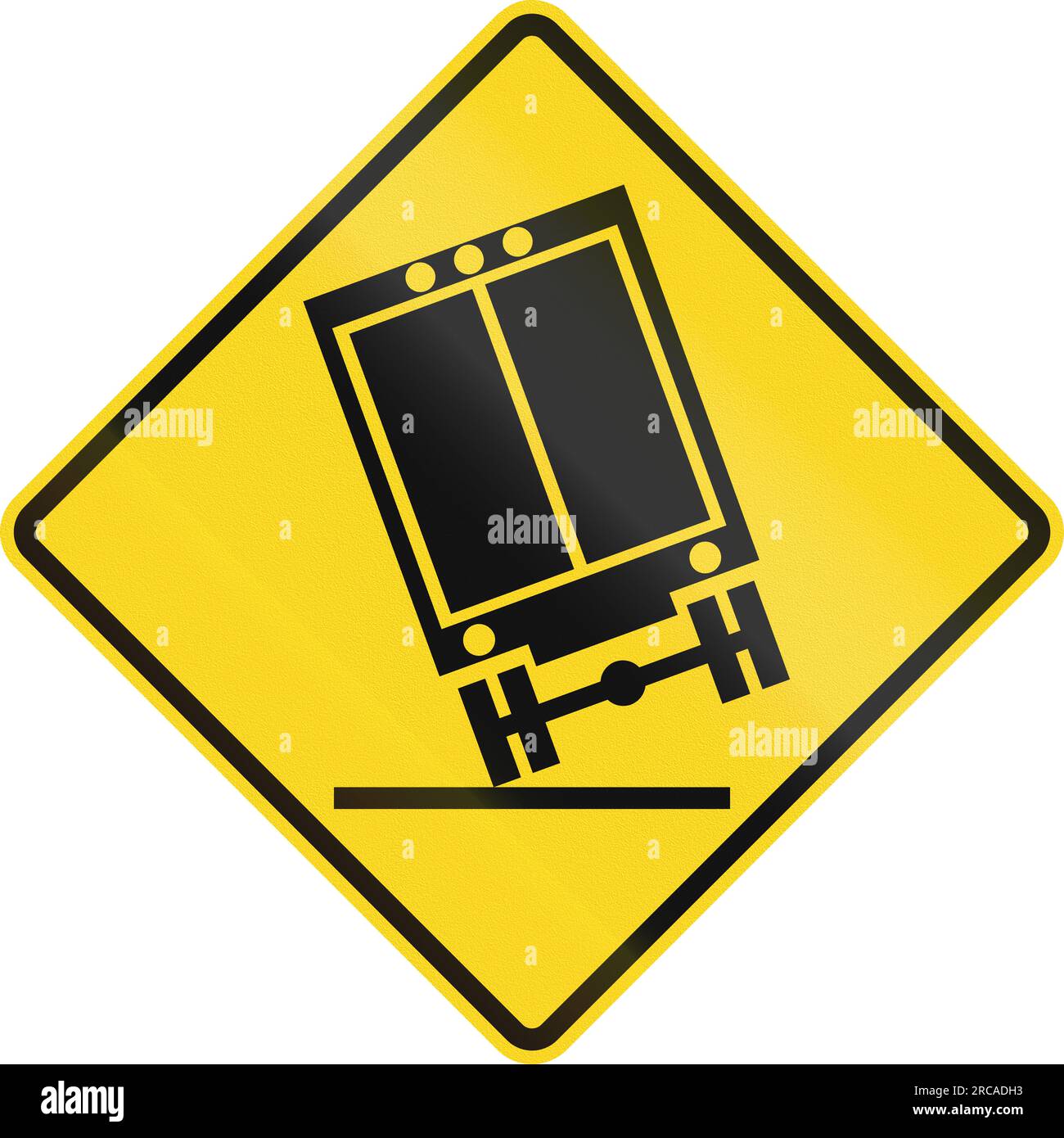 Canadian road warning sign Trucks may tip over on curve. This sign is