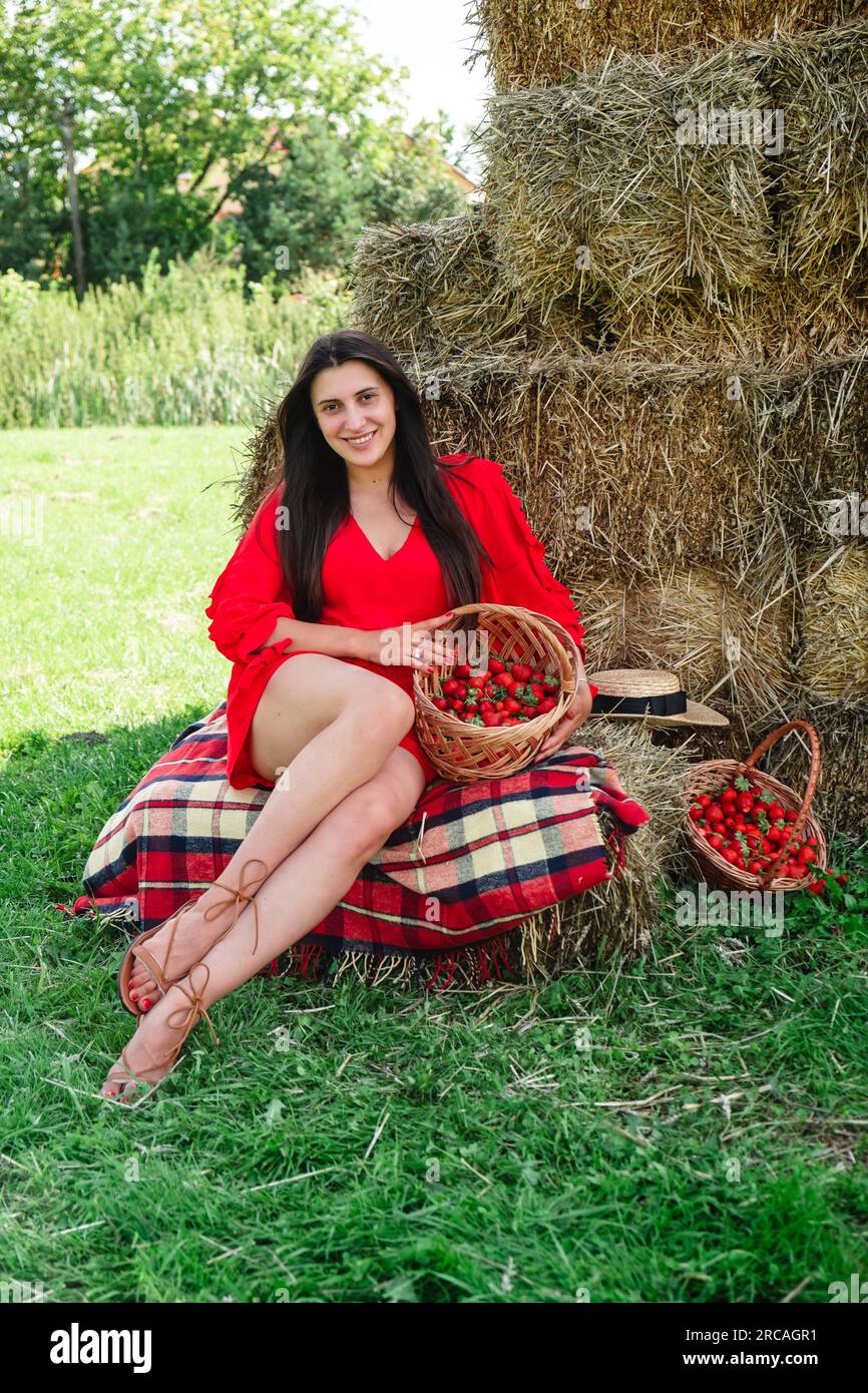 Portrait of Smiling Woman with Basket of Strawberries Stock Photo - Alamy
