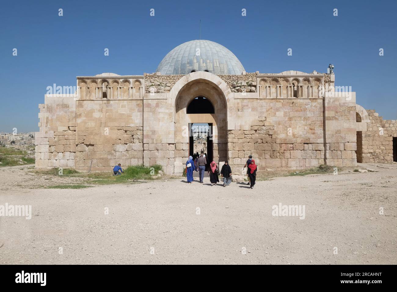 Tourists near the Byzantine Church in Amman Citadel historic site. A ruined ancient church located next to the Umayyad Palace. Amman, Jordan Stock Photo