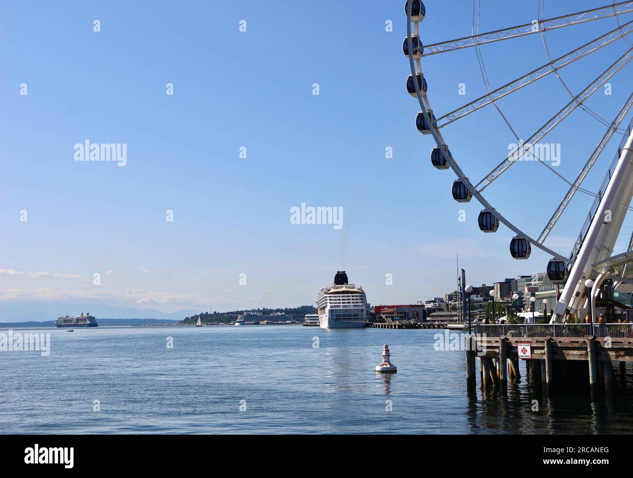 Seattle Great Wheel ferris wheel and cruise ships in port and at sea