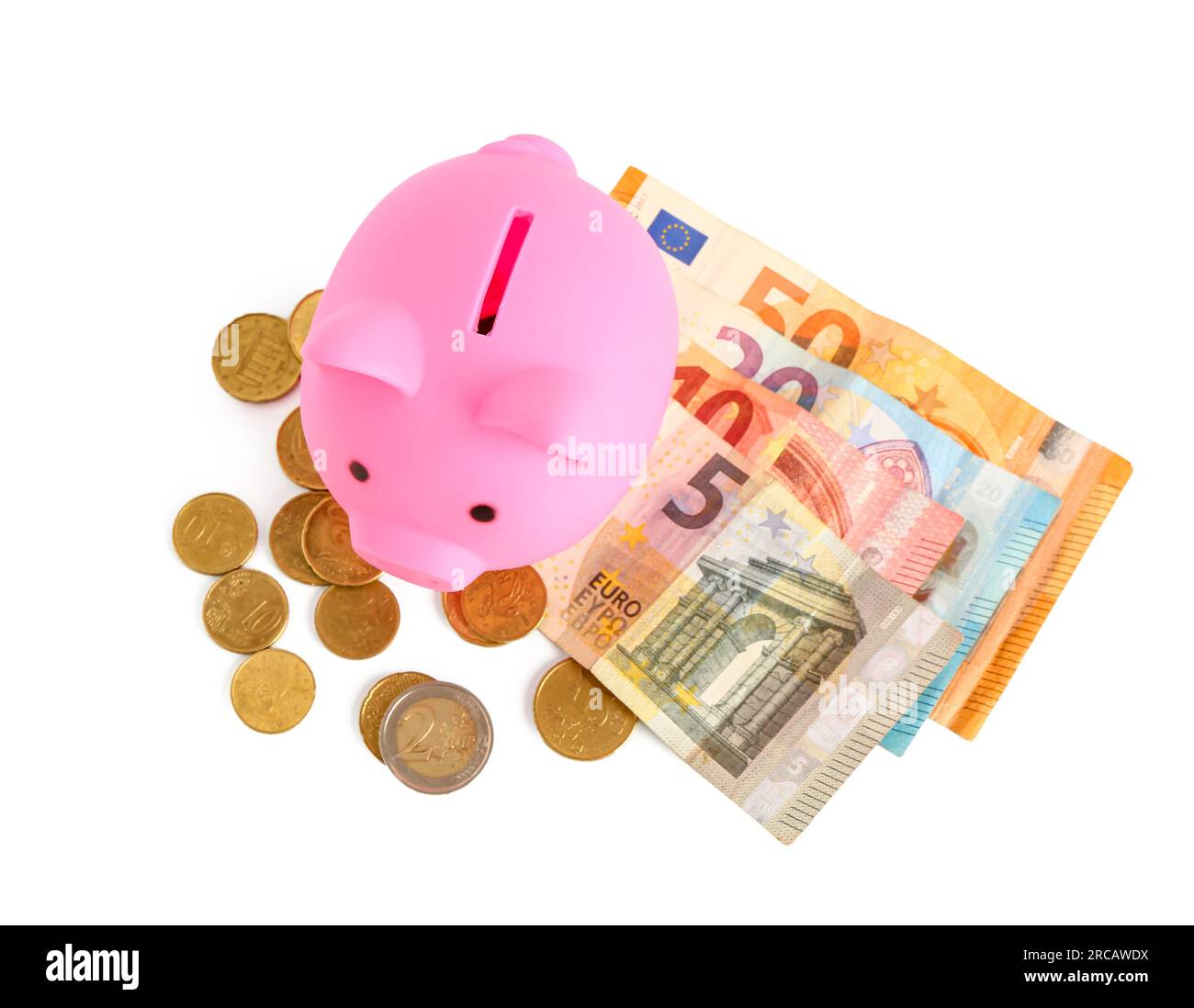 Pink piggy bank with euro banknotes and coins isolated on white ...