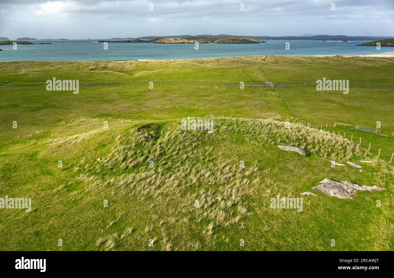 Traigh Na Berie prehistoric wheelhouse seen as round depression left side of artificial mound. On sand dunes at Traigh Na Berie beach, Bhaltos, Lewis Stock Photo