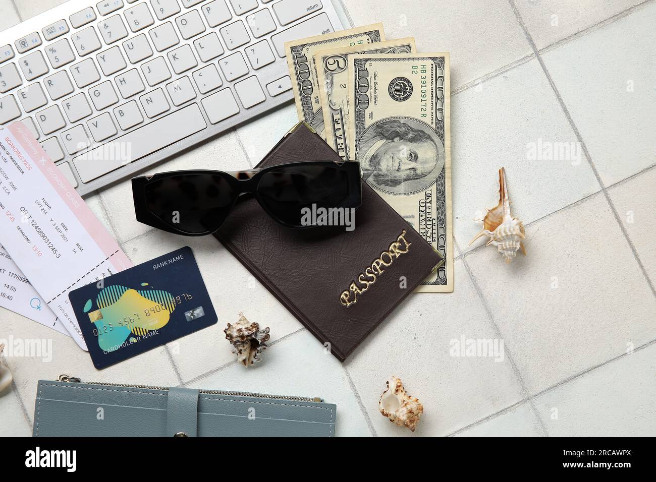 Composition with sunglasses, credit card, money and passport on light