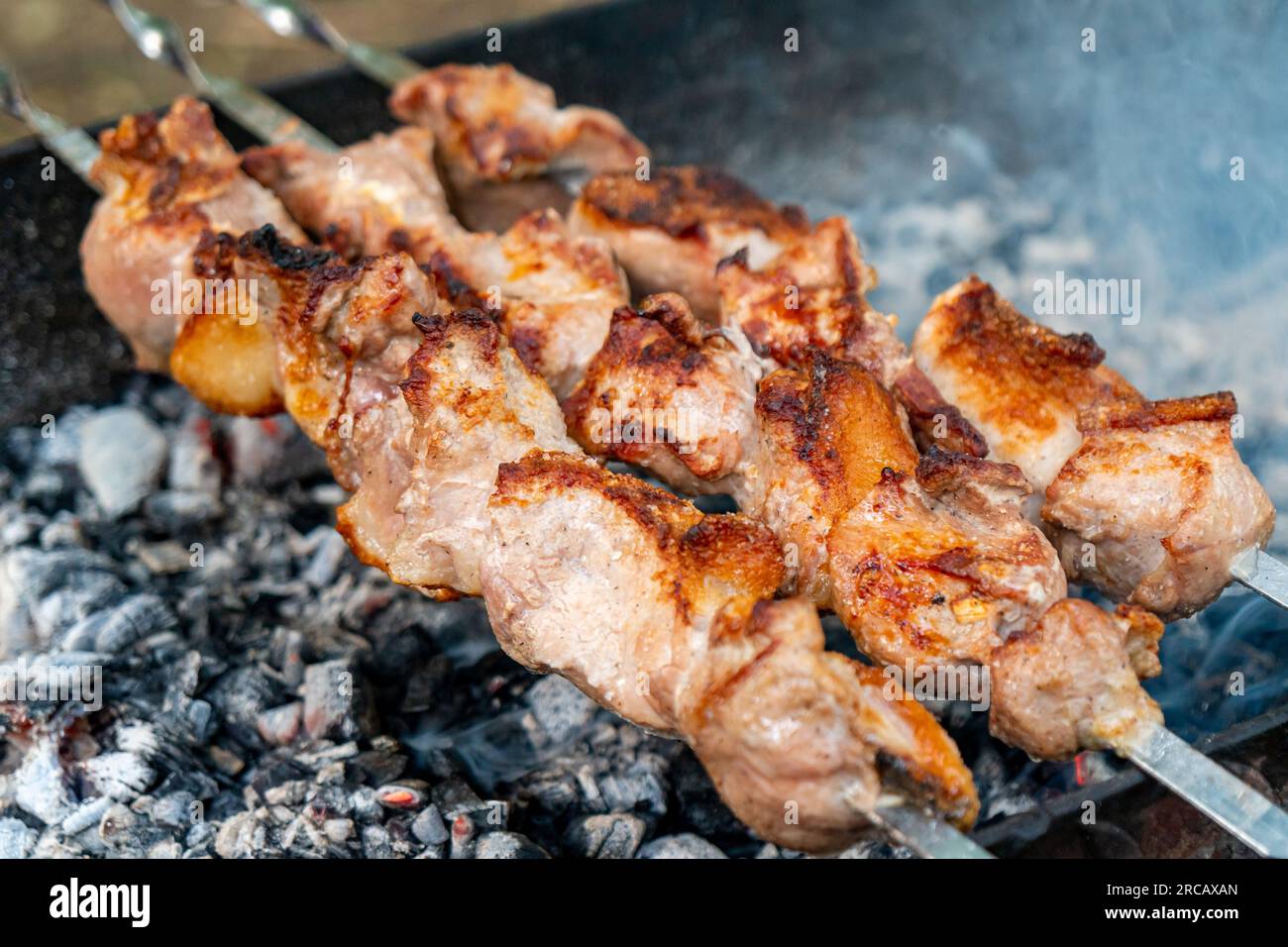 Traditional georgian mtsvadi, grill on the coals with smoke. Shashlik