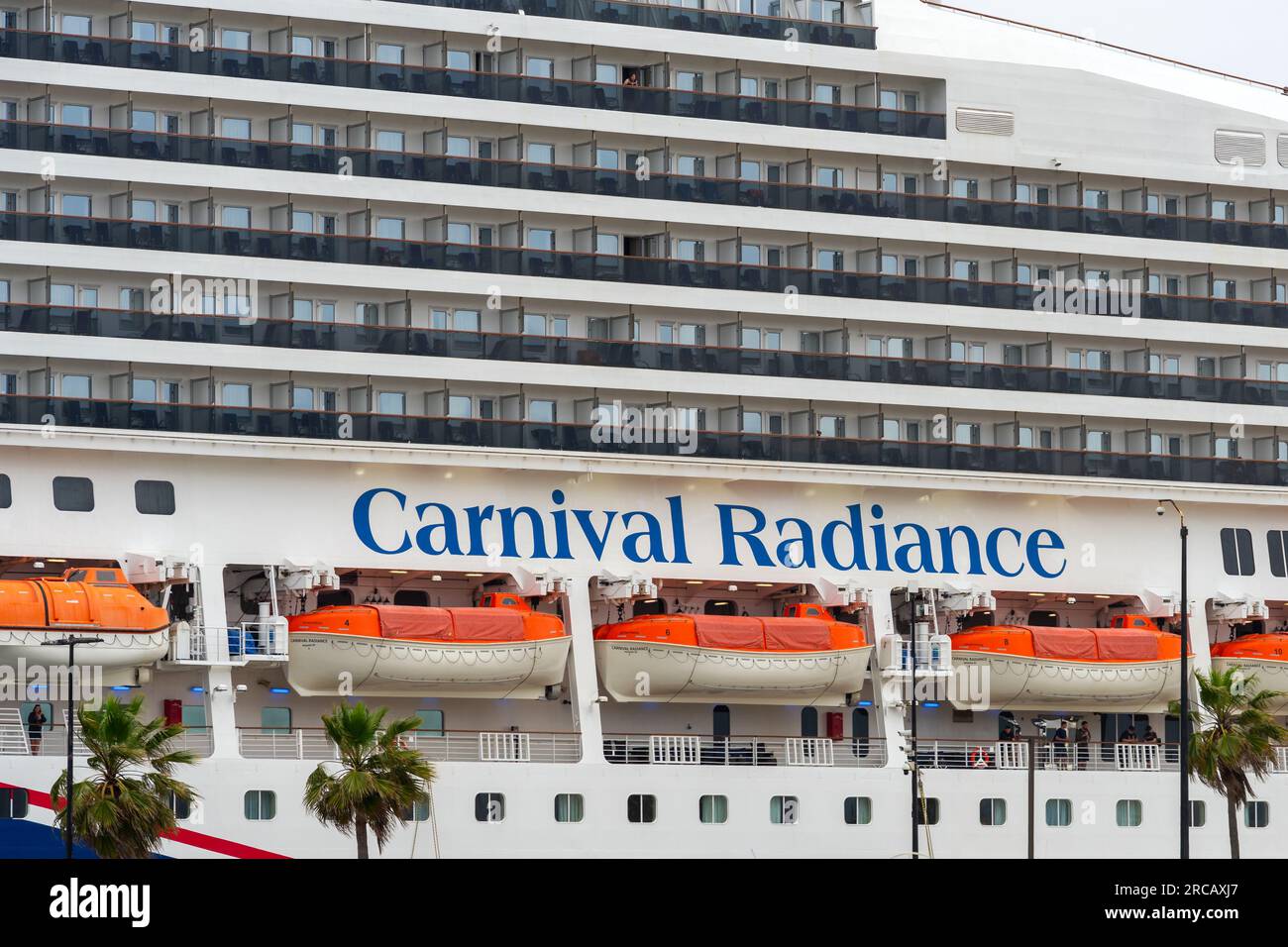 Ensenada, BC, Mexico – June 4, 2023: Carnival Radiance cruise ship with view of  balconies and lifeboats docked in Ensenada, Mexico. Stock Photo