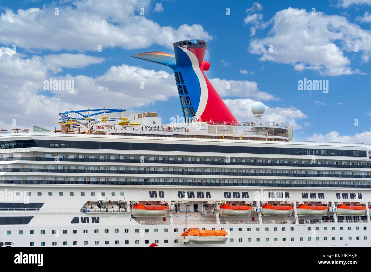 Ensenada, BC, Mexico – June 4, 2023: Carnival Radiance cruise ship with view of the whale tail funnel docked in Ensenada, Mexico. Stock Photo