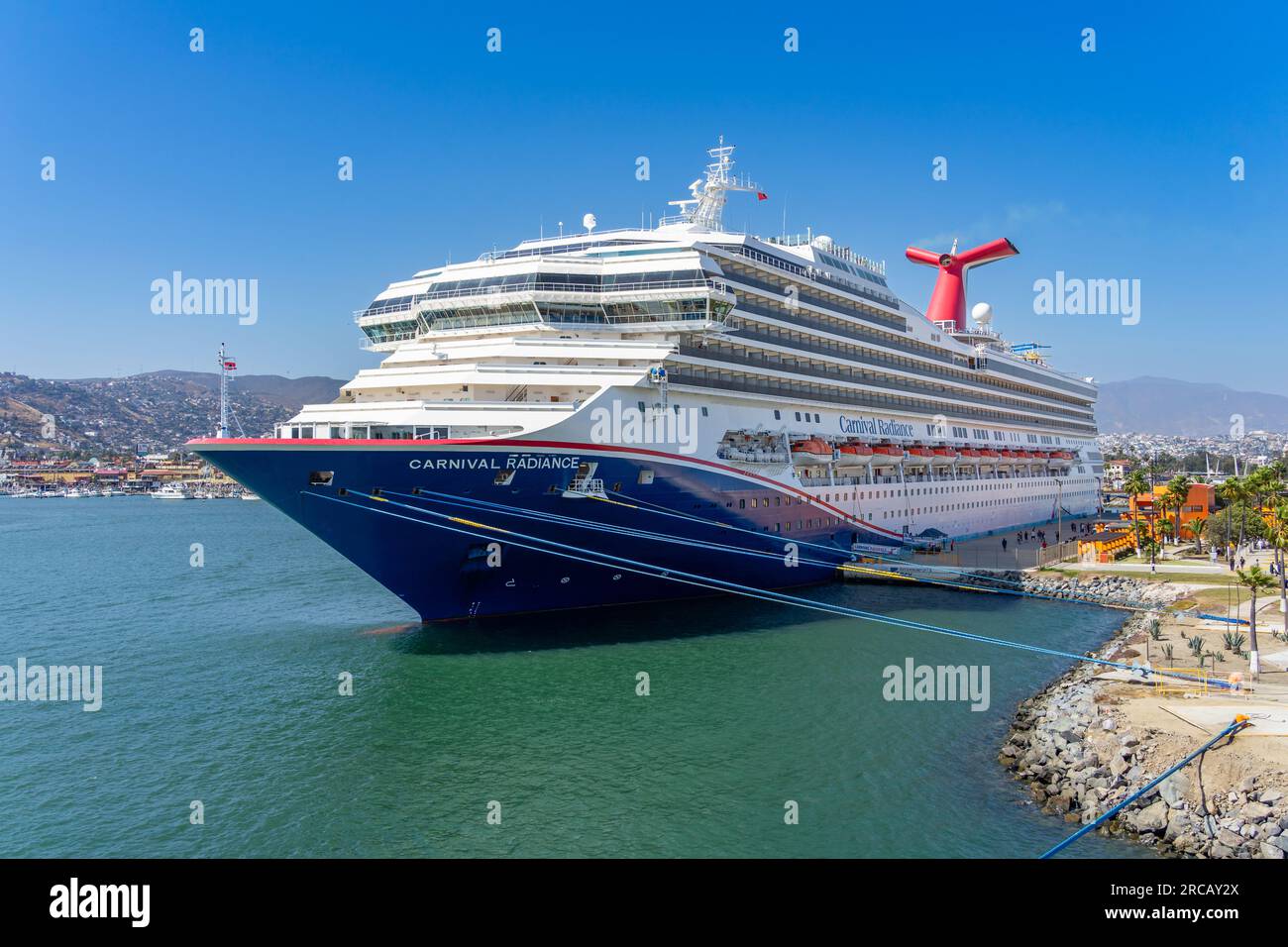 Ensenada, BC, Mexico – June 4, 2023: Wide view of Carnival Corporation’s Carnival Radiance cruise ship docked in the Port of Ensenada, Baja California Stock Photo