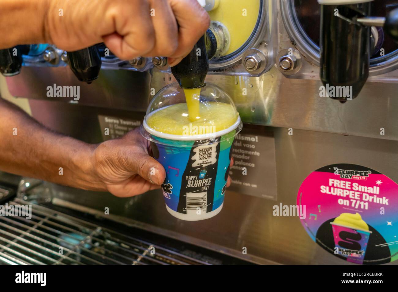 Free Slurpees are given away in a 7-Eleven store in New York on Tuesday, July 11, 2023 (7-11, get it?),the self-proclaimed holiday, Free Slurpee Day! The popular icy, slushy, syrupy drinks are available in regular and diet flavors, in combinations, and the stores have stocked up with extra barrels of syrup to meet the expected demand. According to the meticulous figures kept by 7-Eleven they sell an average of 14 million Slurpees a month and over 150 million Slurpees a year.  (© Richard B. Levine) Stock Photo