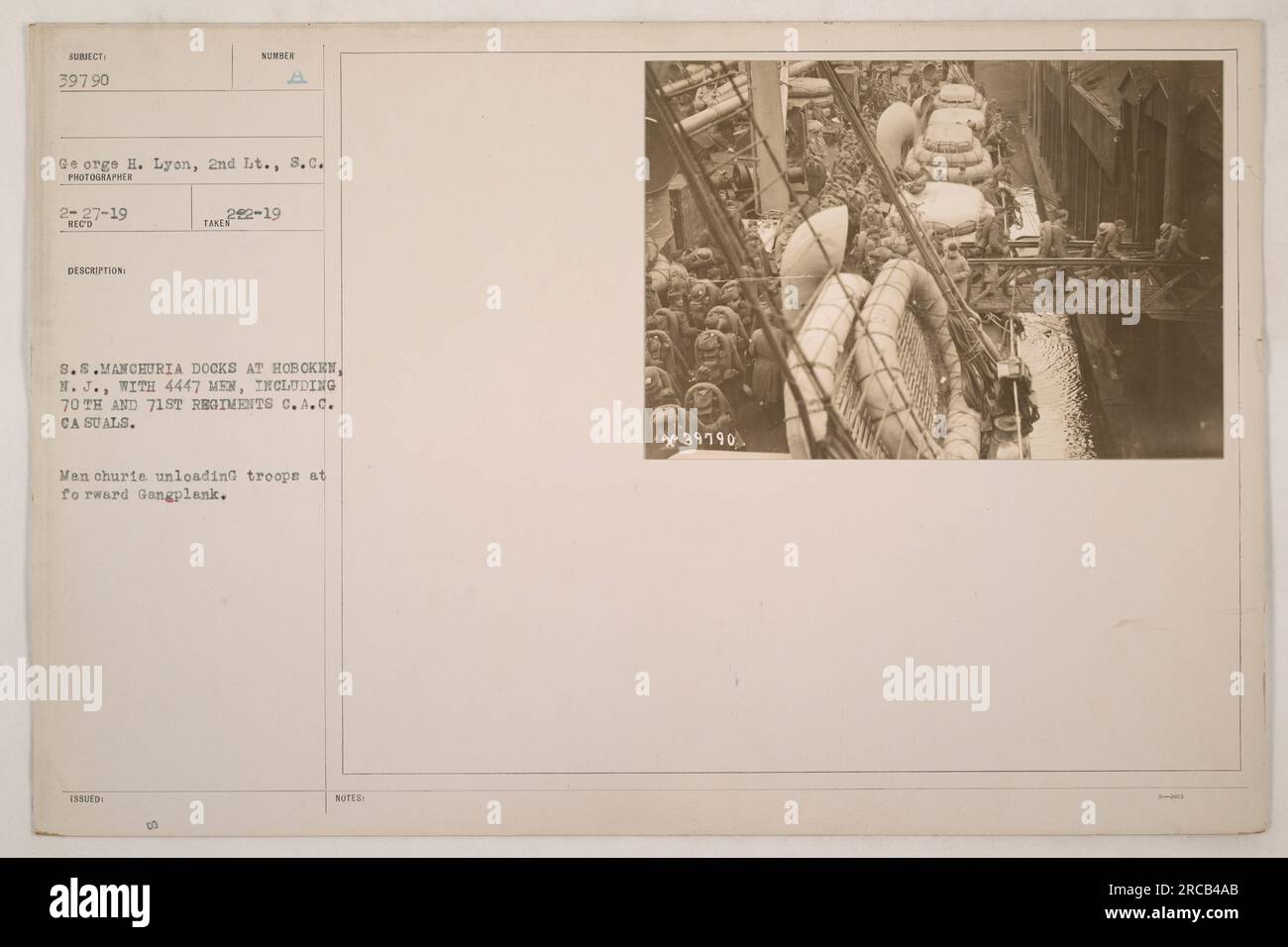 Image caption: S.S. Manchuria unloading troops at the forward gangplank ...