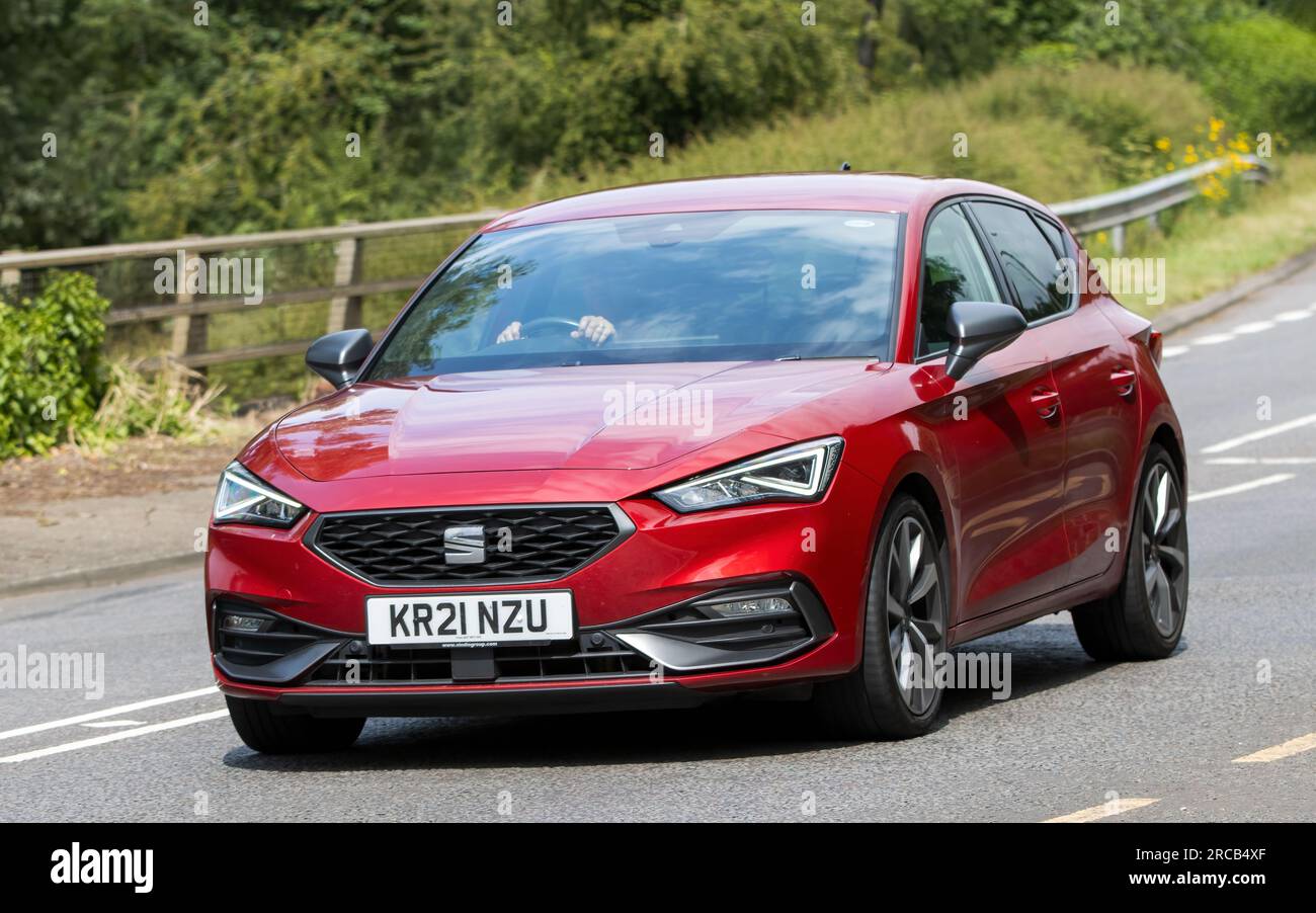 Milton Keynes,UK - July 13th 2023:  2021 hybrid electric SEAT LEON FIRST EDITION car driving on an English road Stock Photo