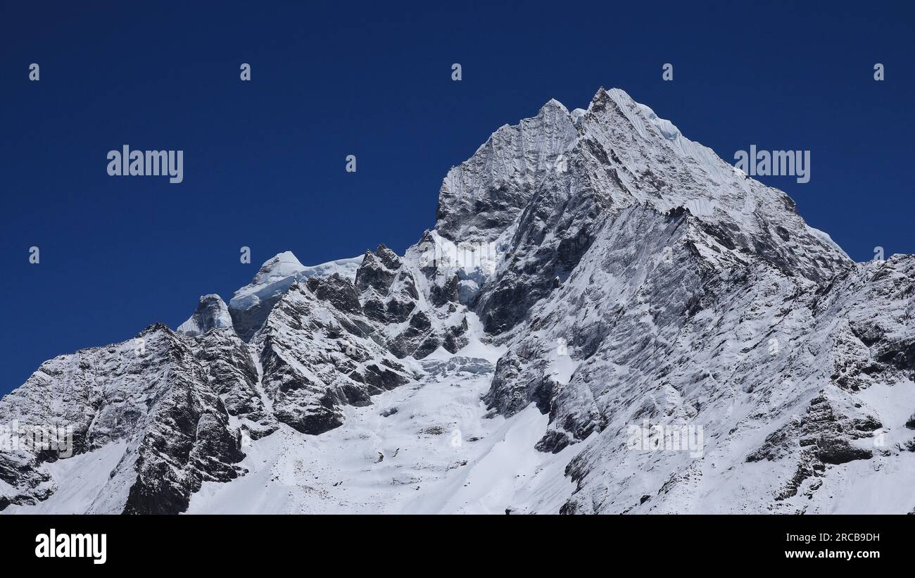 Snow covered Thamserku, view from Namche Bazar Stock Photo