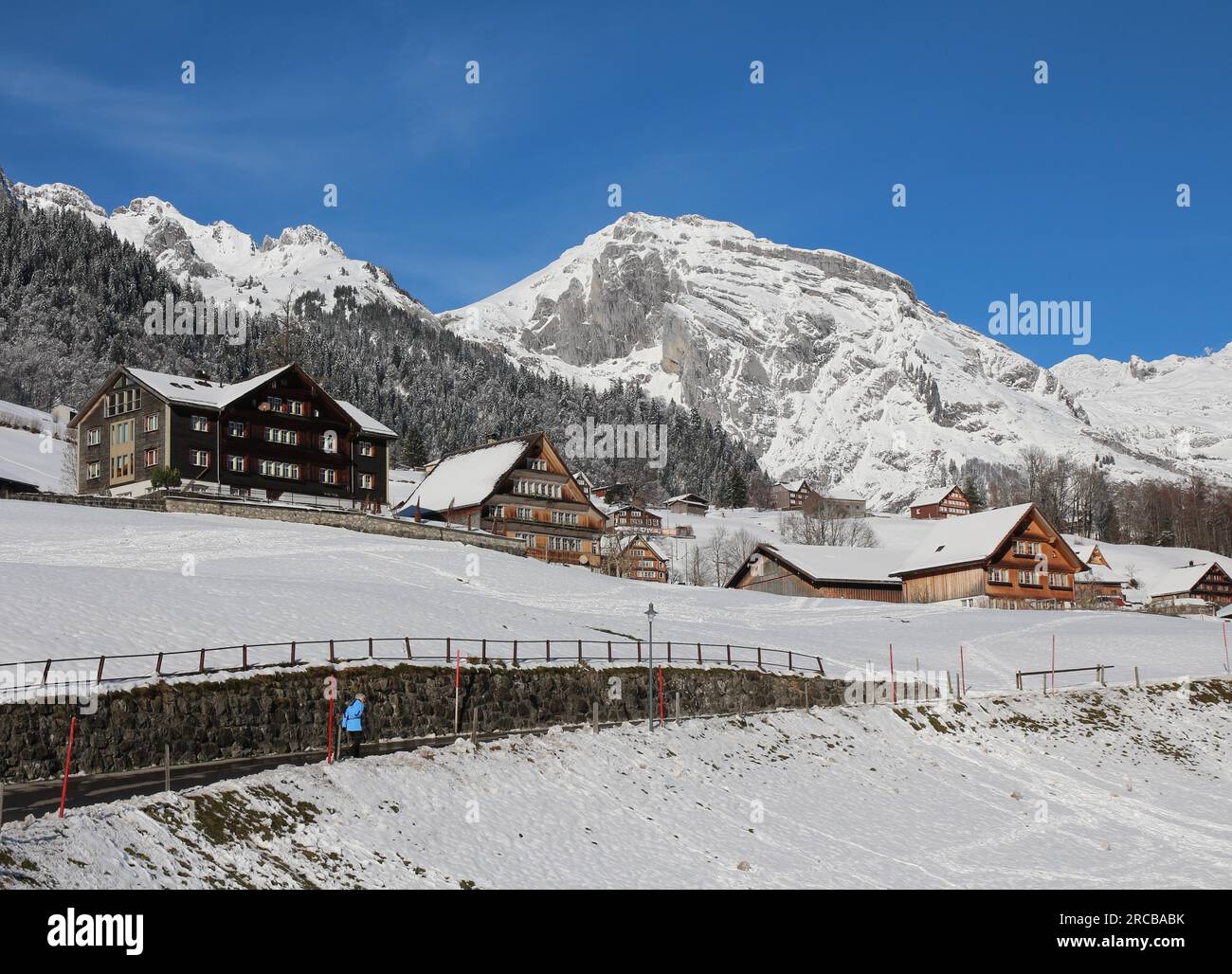 Winter scene in the Toggenburg valley, mountain and traditional architecture Stock Photo