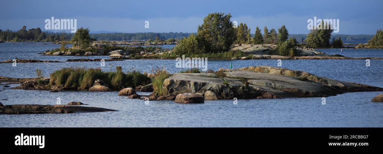 View from a place in Mellerud. Rock formations and small islands covered by trees. Shore of Lake Vanern Stock Photo