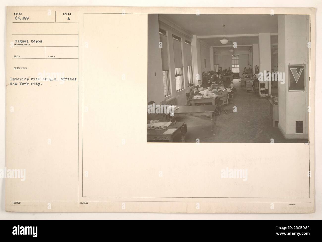 Photograph shows the interior view of the Q.M. (Quartermaster) offices in New York City. The photo was taken by an unidentified photographer for the Signal Corps and has been assigned the number 64,399. The image does not contain any additional significant information. Stock Photo