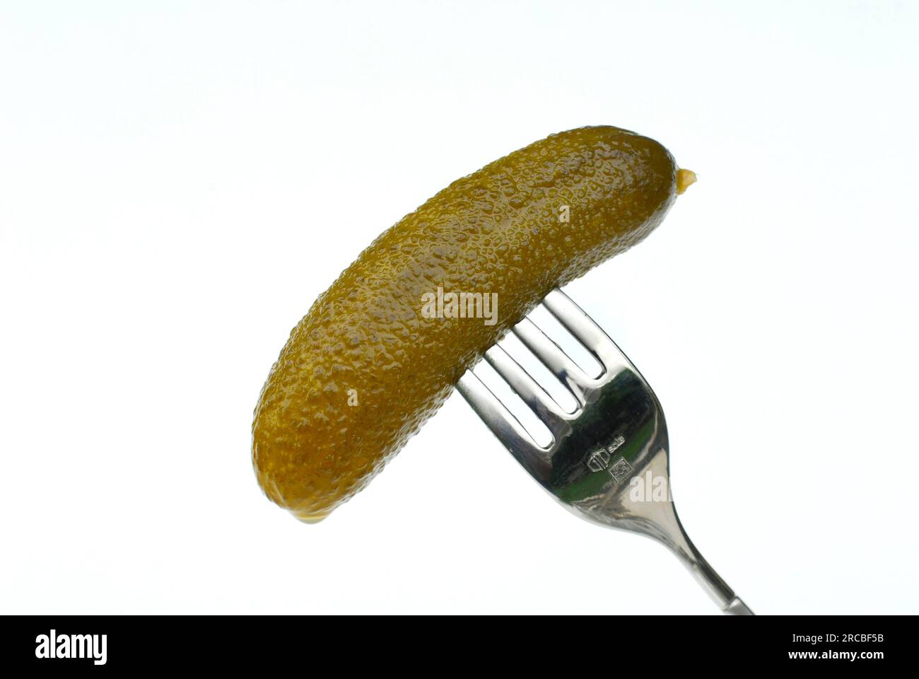 SpiceCucumber (Cucumis) on fork, spice Stock Photo - Alamy