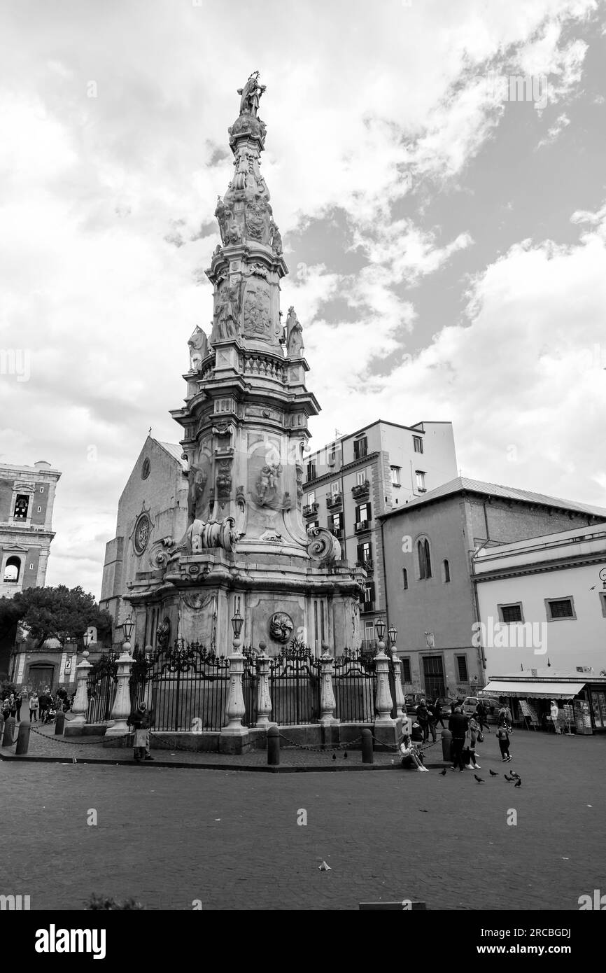 Naples, Italy - April 10, 2022: The Obelisk of the Immaculate Conception or Guglia dell'Immacolata is a Baroque obelisk in Naples located in Piazza de Stock Photo