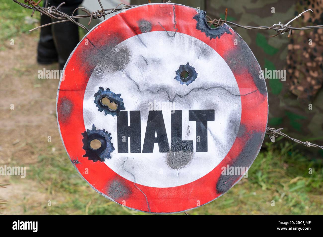 WWII german red and white sign with stop sign and bullet marks Stock Photo