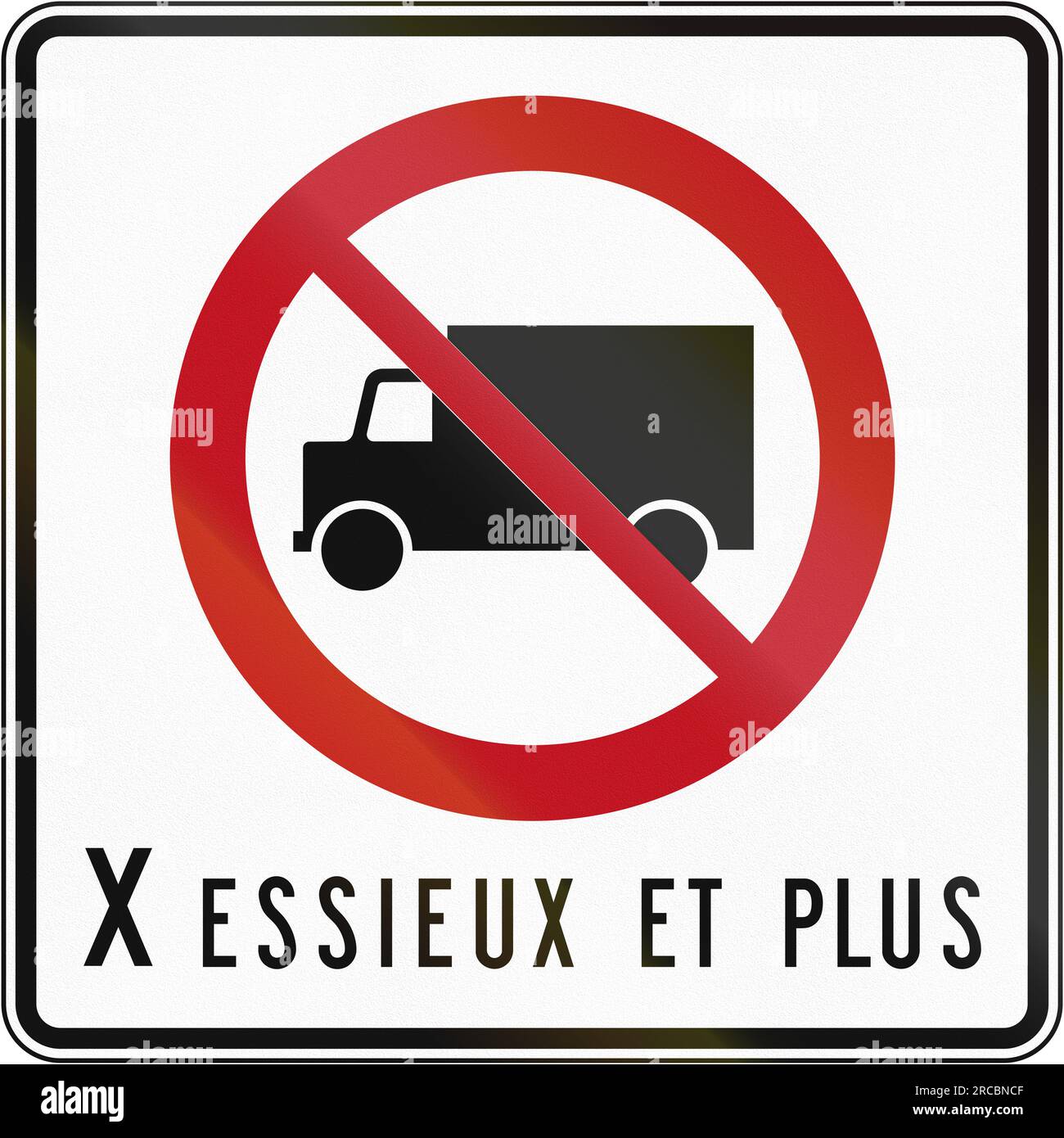 Canadian regulatory traffic sign No lorries. The text means X axles