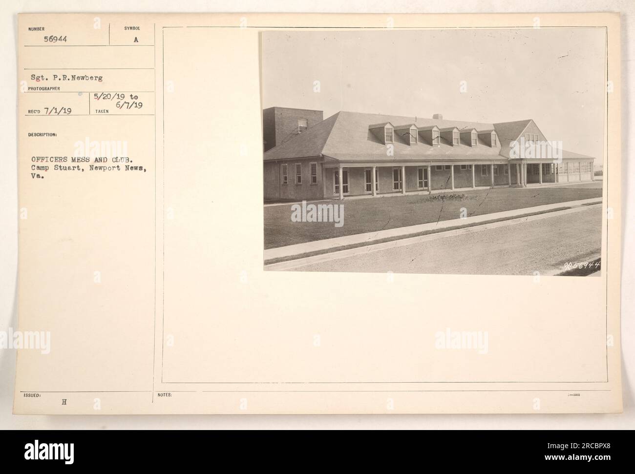 Officers at Camp Stuart in Newport News, Virginia gather in the mess and club area. This photograph, taken between May 20th and June 7th, 1919, captures the social space where officers would relax and socialize during the World War One era. Photographer: Sgt. P.R. Newberg. Stock Photo