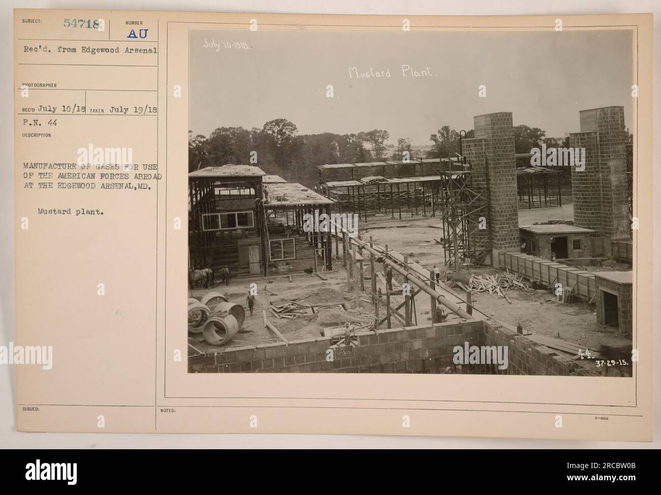 Caption: Manufacture of gases for use of American Forces abroad at Edgewood Arsenal, Maryland. This photograph shows a mustard plant, used in the production of chemical weapons during World War I. With a received date of July 10, 1918, the image is marked as Mustard Plant. Stock Photo