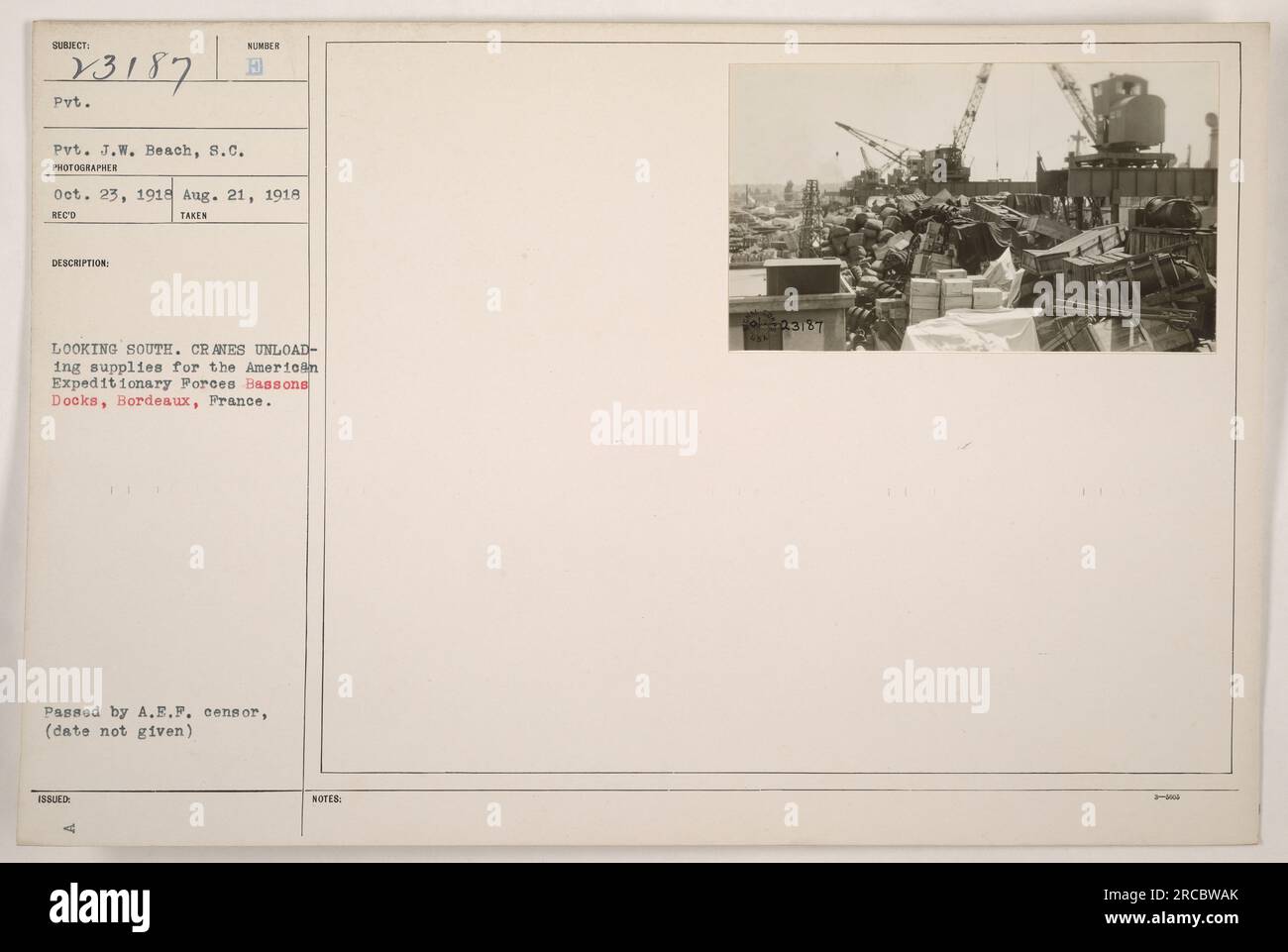 Pvt. J.W. Beach of the American Army surveys the unloading of supplies for the American Expeditionary Forces at Bassons Docks, Bordeaux, France. The photograph, taken on August 21, 1918, shows cranes at work as materials are brought to shore. The image is dated October 23, 1918, and has been approved by the A.E.F. censor. Stock Photo