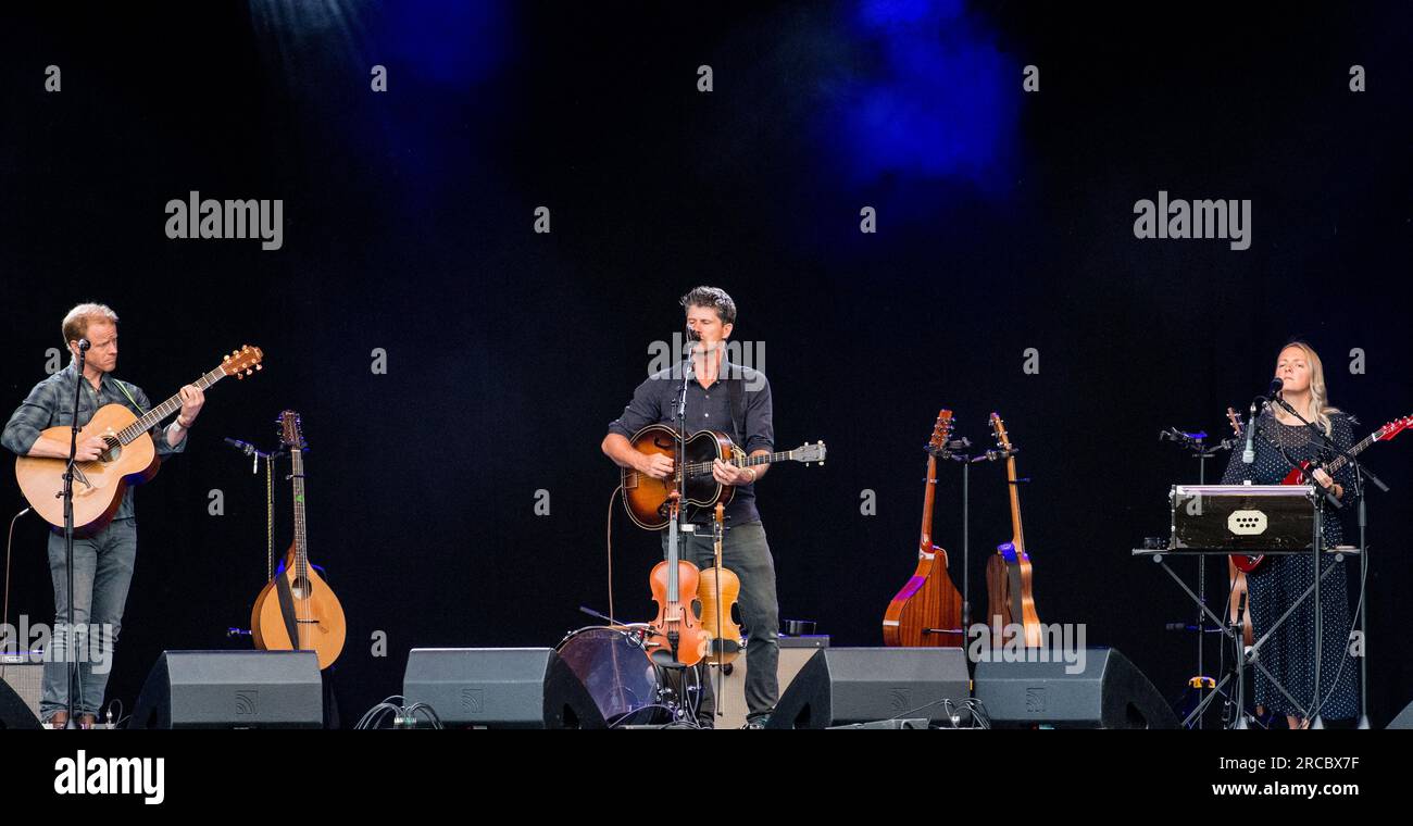 Seth Lakeman, Benji Kirkpatrick and Alax Hart playing live on stage at the 2023 GTSF music festival, Southwell, Nottinghamshire. Stock Photo