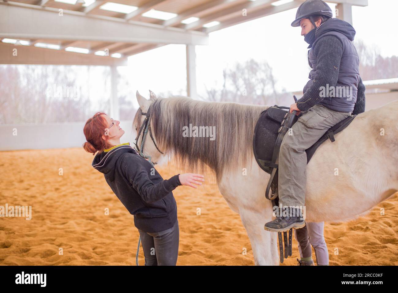 Horse therapy. therapeutic equestrian therapist assistance help patient