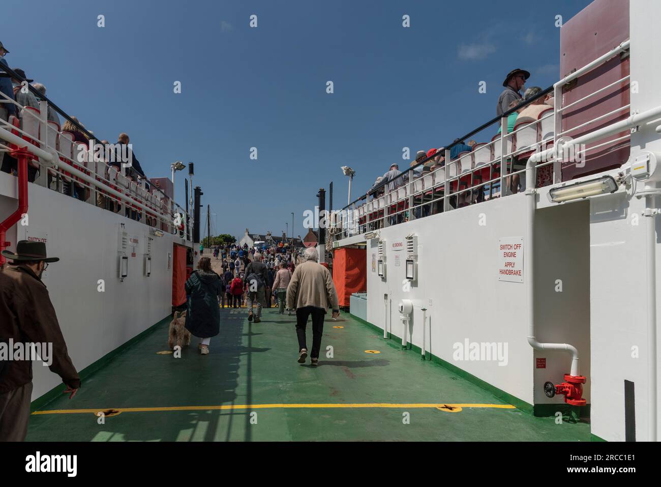 Isle of Iona, Scotland, UK, 6 June 2023. The CalMac ferry  Loch Buie in  Iona with foot passengers disembarking from lower deck to the village. Stock Photo