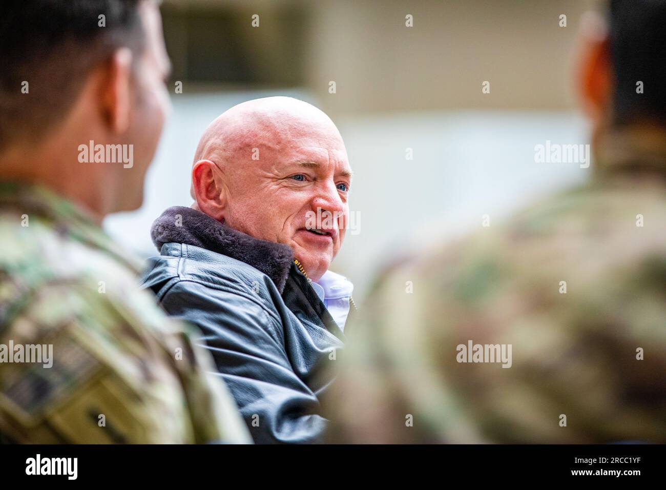 Jasionka, Poland. 12th July, 2023. U.S. Senator Mark Kelly, D-AZ, speaks with U.S Army Paratroopers assigned to the 82nd Airborne Division, during a meet and greet with members of a congressional delegation at Rzeszow Jasionka Airport, July 12, 2023 in Jasionka, Poland. The paratroopers are positioned along the border with Ukraine in support of NATO. Credit: Spc. Vincent Levelev/US Army Photo/Alamy Live News Stock Photo