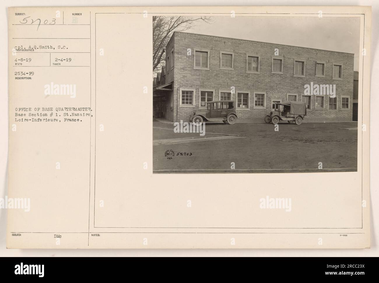 A soldier filling out paperwork at the Office of Base Quartermaster in
