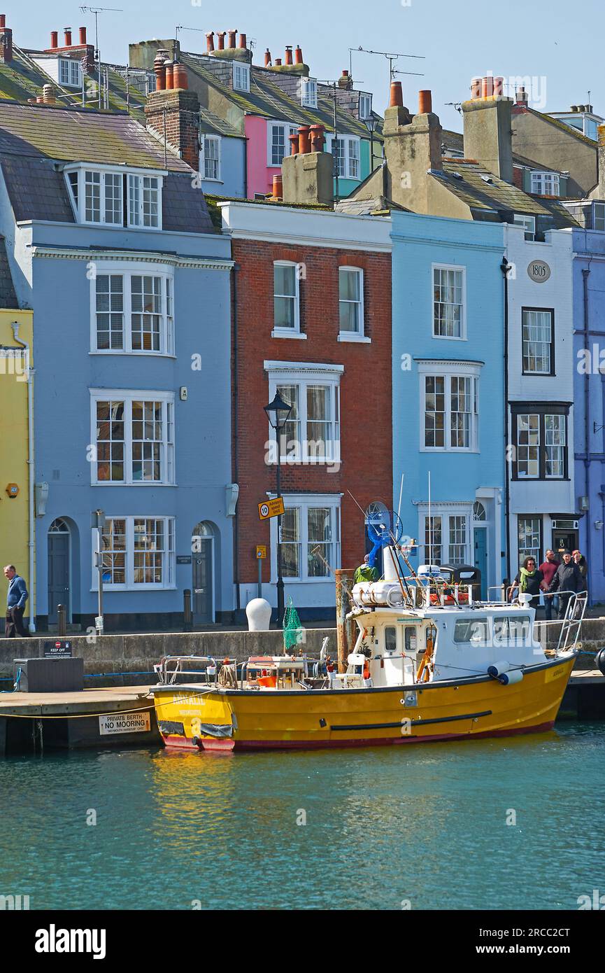 Fishing boats and colourful quayside, Weymouth, Dorset, Stock Photo