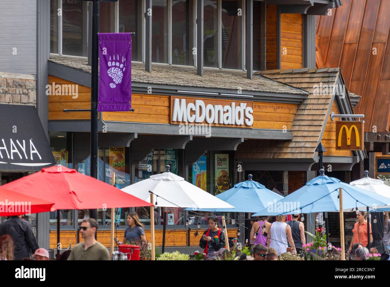BANFF, CANADA JULY 5, 2023 McDonald's restaurant sign on busy Banff