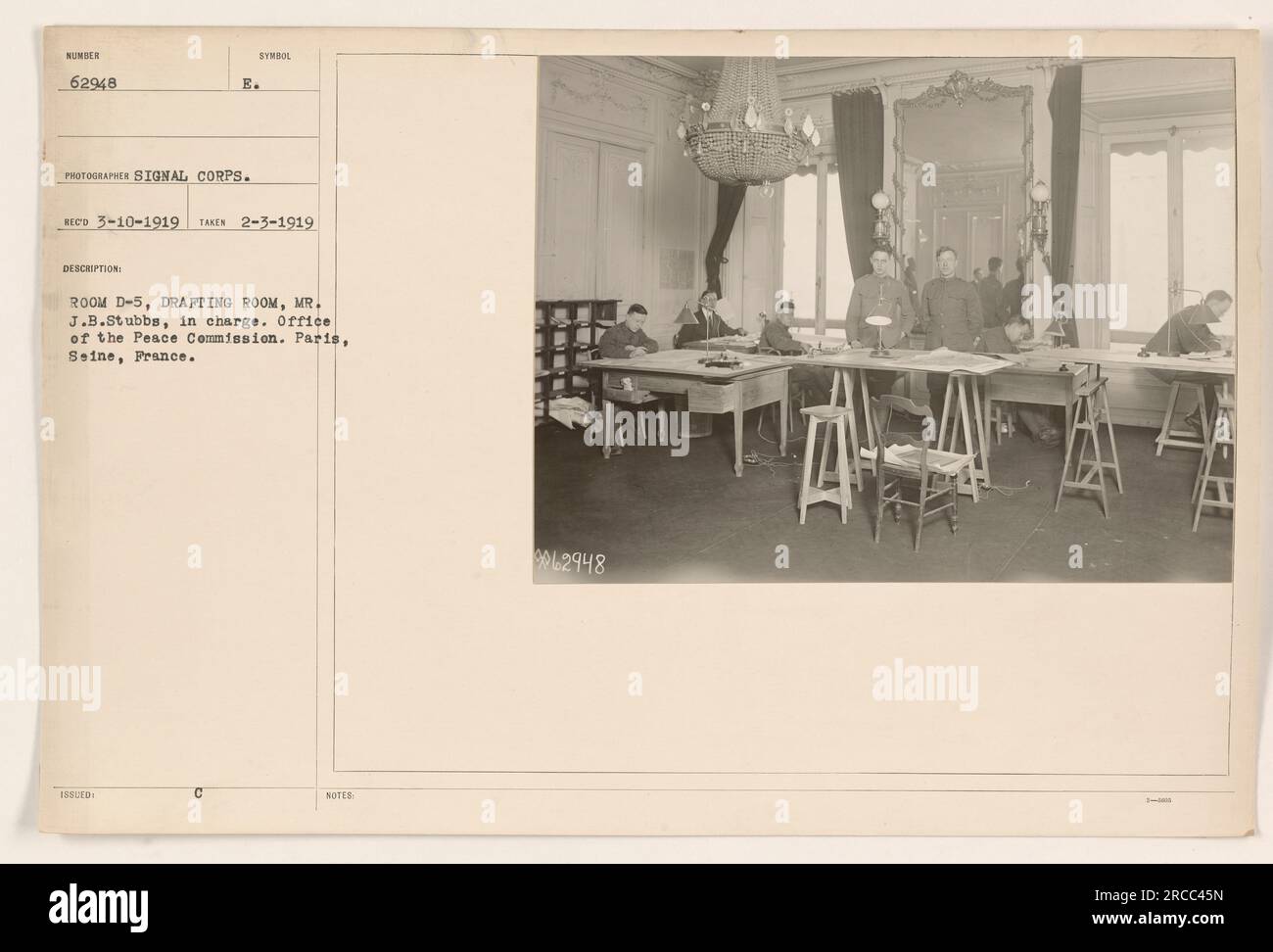 Office of the Peace Commission in Paris, France. Mr. J.B. Stubbs is in charge of the drafting room, identified as Room D-5. The photo was taken on February 3, 1919, by the Signal Corps. This image is part of the numbering system, with the description and notes listed as 18SUED 62948. Stock Photo