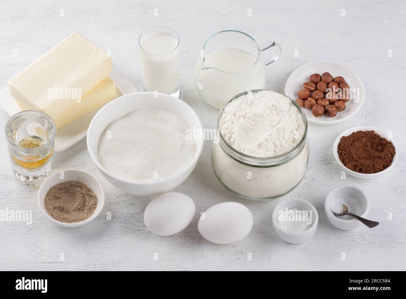 Ingredients: flour, sugar, butter, milk, cream, eggs, vanilla sugar, cocoa, nuts, cognac, salt and baking powder for the traditional Russian cake Leni Stock Photo