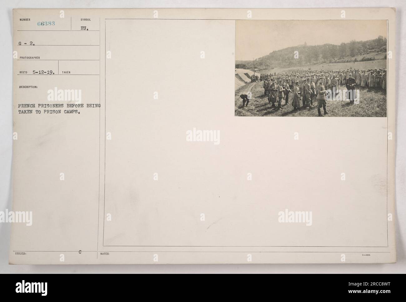 The photograph shows French prisoners of war at a designated location ...