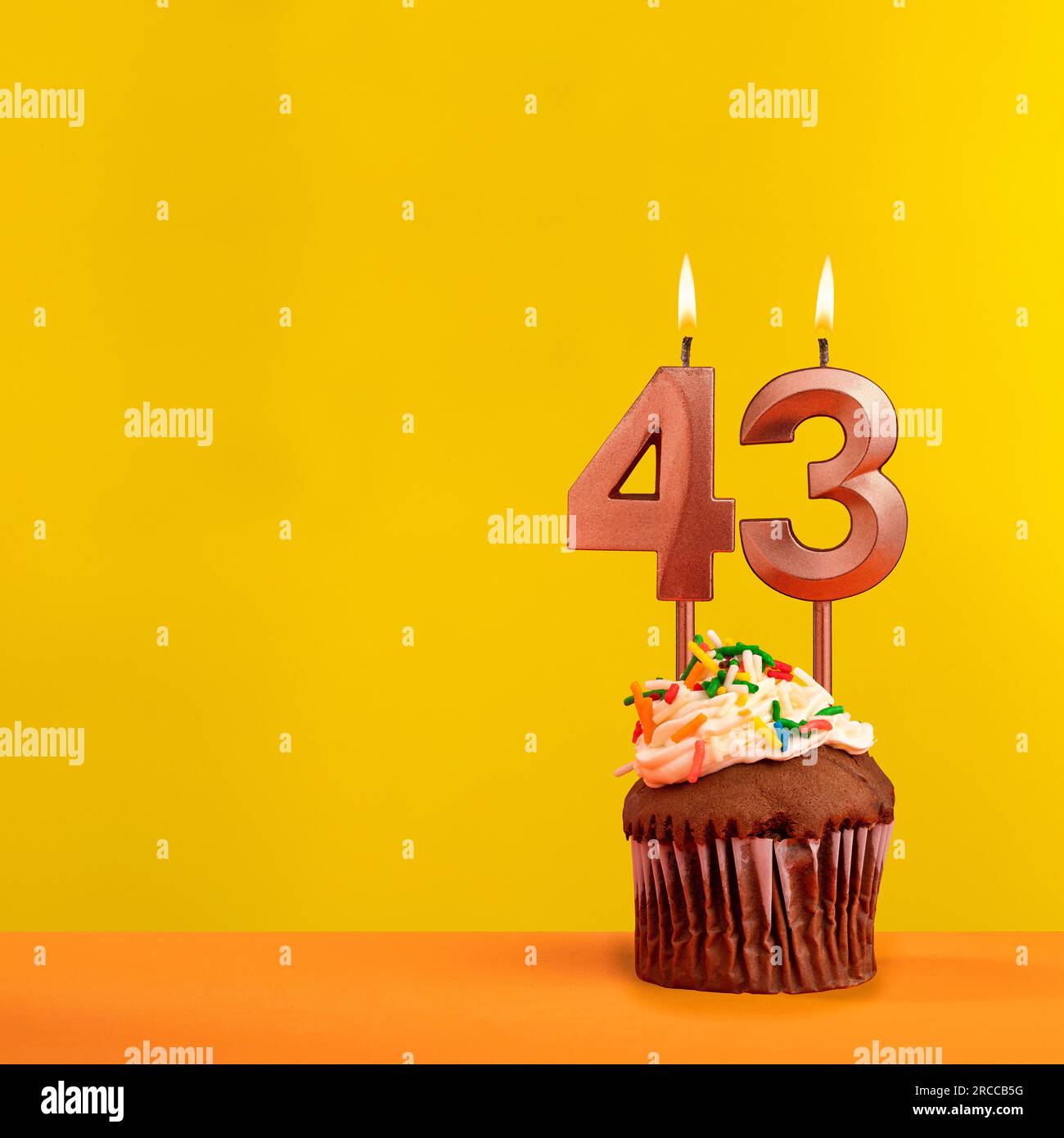 Candle with flame number 43 - Birthday card on yellow background Stock ...