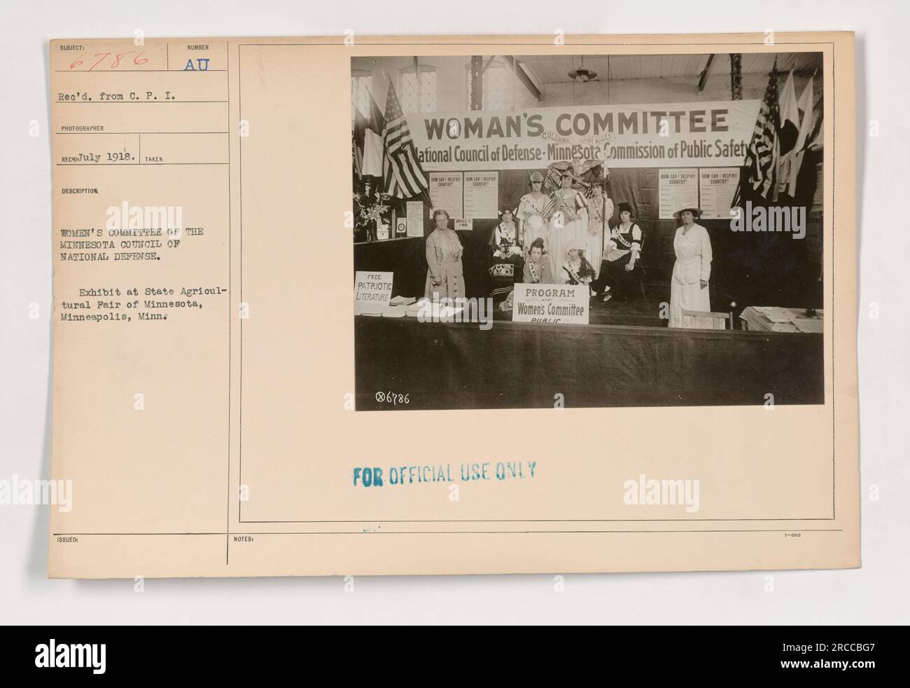 Women's Committee of the Minnesota Council of National Defense flags on display at the State Agricultural Fair in Minneapolis, July 1918. The flags were used to promote patriotic literature and support the National Council of Defense and Minnesota Commission of Public Safety. This image is part of the Photographs of American Military Activities during World War One collection. Stock Photo
