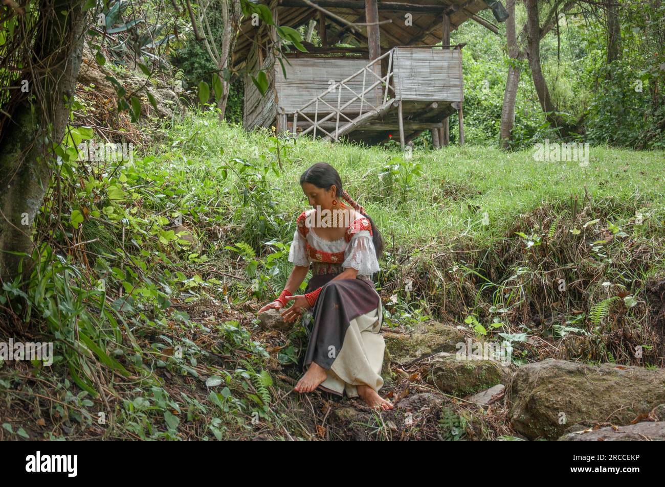 community of ancestral shamans outdoors, woman collects medicinal
