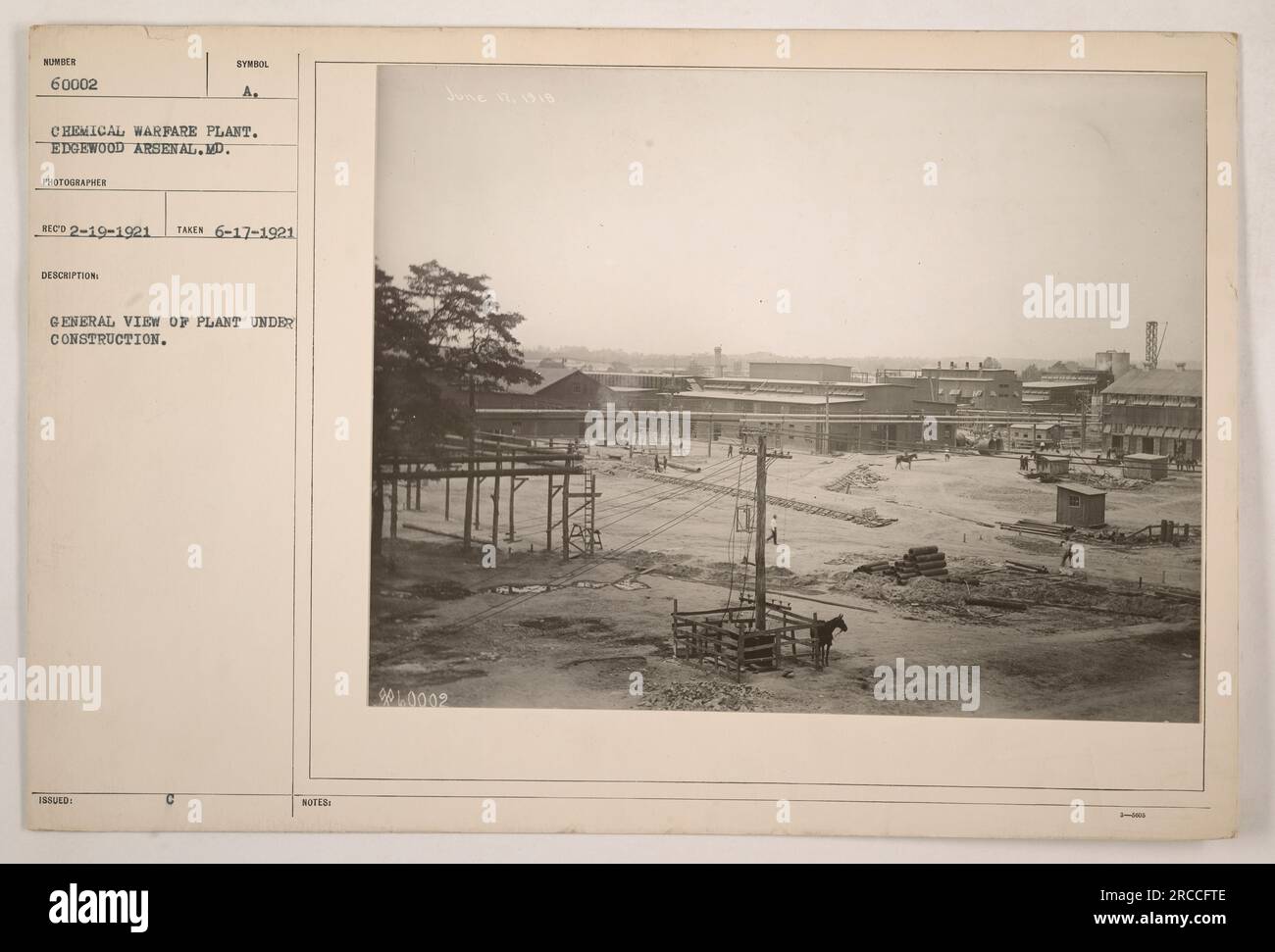 General view of the SE 60002 chemical warfare plant under construction at Edgewood Arsenal, MD. The photograph, taken on June 17, 1921, depicts the progress of the plant's construction. It was captured by photographer A. Reco and the description notes its issuance as note 901.0002. Stock Photo